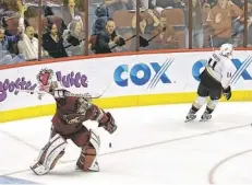  ?? DAVID KADLUBOWSK­I/AZCENTRAL SPORTS ?? Coyotes goalie Mike Smith celebrates a 5-4 shootout win Saturday night after stopping Ducks center Saku Koivu (11).