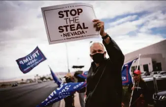  ?? Wong Maye-E / Associated Press 2020 ?? Backers of former President Donald Trump rally at the Clark County Elections Department in North Las Vegas, Nev., in 2020 in support of Trump’s baseless claims of election fraud.