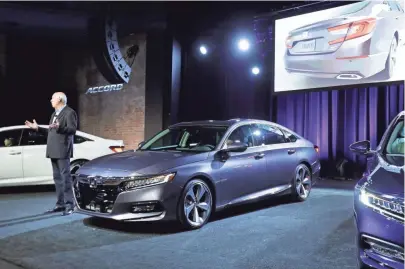  ?? CARLOS OSORIO, AP ?? American Honda car boss Jeff Conrad introduces the ’18 Accord on Friday in Detroit, despite being built in Ohio.