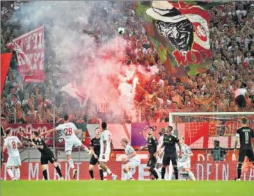  ??  ?? FC Cologne fans light a flare during the club’s first home game of 2019/20 Bundesliga season, against Borussia Dortmund in August.
GETTY