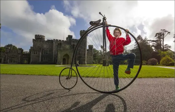  ??  ?? Jamie McCafery gets to grips with an 1880s penny farthing bicycle at the launch of the Irish National Cycling Championsh­ips at Johnstown Castle.