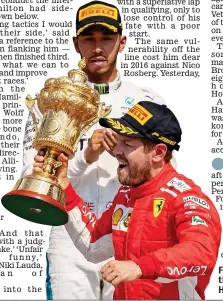  ?? EPA ?? Fuming: Vettel parades the trophy in front of Hamilton