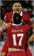  ??  ?? HERO: Mitrovic celebrates his goal with Filip Kostic