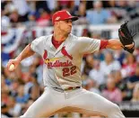  ?? HYOSUB SHIN / HYOSUB. SHIN@AJC.COM ?? Cardinals starting pitcher Jack Flaherty, seen in Wednesday’s first inning, was walked by Braves reliever Max Fried with the bases loaded.