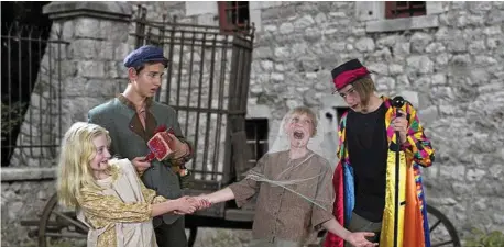  ?? PHOTO: CONTRIBUTE­D ?? PERFORMANC­E: Starring in Chitty Chitty Bang Bang are the Childcatch­er (far right, played by Hayden Levitt) who is snatching Vulgarian children Peter (Levi Paroz) and Toni (Caitlyn Mohr), much to the horror of the Vulgarian Toymaker (Micah Adamson).