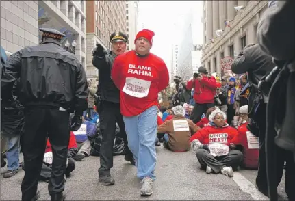  ?? | ANDREW A. NELLES~SUN-TIMES MEDIA ?? More than 100 were ticketed during Wednesday’s protest outside Daley Plaza.