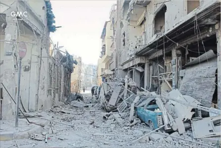  ?? GHOUTA MEDIA CENTRE THE ASSOCIATED PRESS ?? Syrians inspect destroyed buildings after airstrikes and shelling by Syrian government forces hit in the eastern Ghouta region near Damascus, Syria.