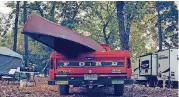  ??  ?? A truck parked in the campground­s at 2017’s Illinois River Jam in Tahlequah.