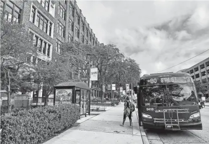  ?? JOURNAL SENTINEL KELLY MEYERHOFER / MILWAUKEE ?? The bus stop is steps away from the downtown campus of Milwaukee Area Technical College.