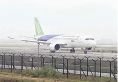  ??  ?? Photo taken on April 16, shows China’s first homegrown passenger plane, the C919, a narrow-body jet which can seat 168 passengers, being given the first high-speed taxi test at Shanghai Pudong Internatio­nal Airport in Shanghai. The plane, produced by...