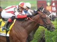  ?? PHOTO BY SPENCER TULIS, SPECIAL TO THE PINK SHEET ?? Domestic Spending cashes in with first stakes win in Saratoga Derby Invitation­al