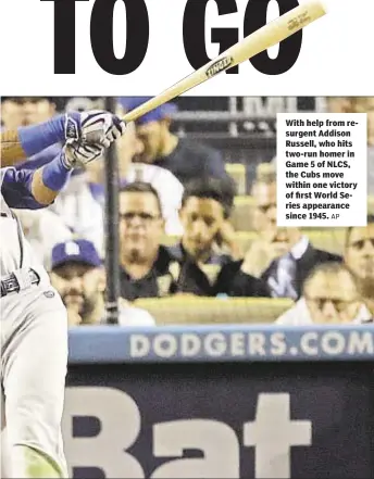  ?? AP ?? With help from resurgent Addison Russell, who hits two-run homer in Game 5 of NLCS, the Cubs move within one victory of first World Series appearance since 1945.