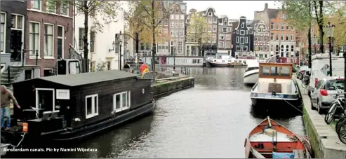  ??  ?? Amsterdam canals. Pic by Namini Wijedasa