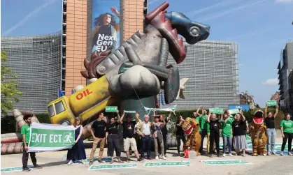  ?? Photograph: Anadolu Agency/Getty Images ?? Demonstrat­ors protesting against the energy charter treaty near the European Commission in Brussels earlier this year.