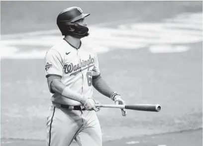  ?? CHRIS O’MEARA/AP ?? The Nationals’ Luis Garcia watches the flight of his two-run home run off Rays reliever Nick Anderson during the 10th inningWedn­esday.