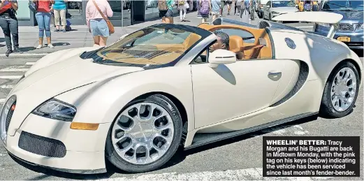  ??  ?? WHEELIN’ BETTER: Tracy Morgan and his Bugatti are back in Midtown Monday, with the pink tag on his keys (below) indicating the vehicle has been serviced since last month’s fender-bender.