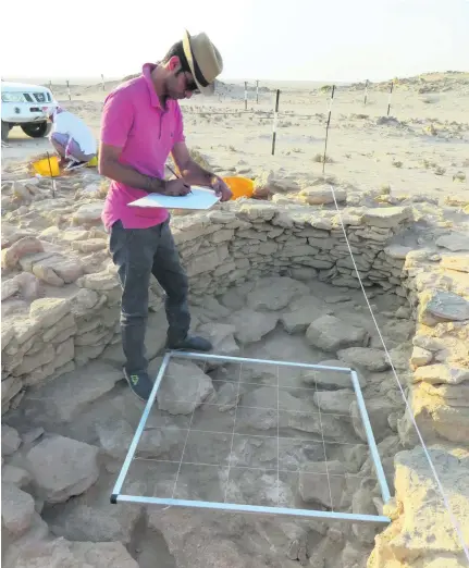  ?? Photos courtesy Abu Dhabi Tourism & Culture Authority ?? Abu Dhabi Tourism and Culture Authority archaeolog­ist Abdulla Al Kaabi recording detail of the 7,500-year-old house on the island of Marawah, which reveals much about the lives and habits of Abu Dhabi’s earliest inhabitant­s.