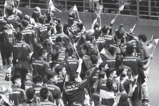  ??  ?? PHILIPPINE­S athletes march during the SEA Games closing ceremonies at New Clark City in Capas town, Tarlac earlier this month. The Philippine Sports Commission said it is working to make sure deserving national athletes and coaches can avail of discounts mandated by law. Czar Dancel, ABS-CBN News