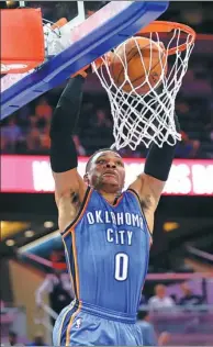  ?? JOHN RAOUX / AP ?? Oklahoma City’s Russell Westbrook dunks for two of his 57 points against the Orlando Magic on Wednesday in Orlando, Florida. The Thunder won 114-106 in overtime.