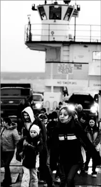  ??  ?? Students spill out of the ferry as it docks on Christian Island.