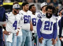  ?? Tom Pennington / Getty Images ?? Dak Prescott (4) says he didn’t need much time to get back in sync with Ezekiel Elliott (21) and other longtime teammates.