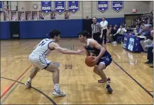  ?? SENTINEL & > ENTERPRISE / NICK MALLARD ?? Leominster’s Justin Dadah Jr. drives against Norwood’s Noah Beaudet during Monday night’s game.