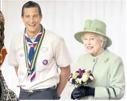  ??  ?? Bear Grylls meets with Her Majesty The Queen in his role as head of The Scout Associatio­n.