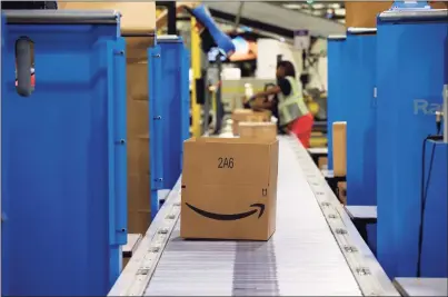  ?? Brian Cassella / TNS ?? Amazon is offering $500 signing bonuses for seasonal workers in Connecticu­t heading into the 2021 holiday season, on top of pay of up to $18.25 an hour.