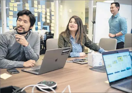  ?? David Butow For The Times ?? A GROWING number of technology workers are migrating to an even newer sector, cannabis. Employees in the industry include veterans from such companies as Amazon, Microsoft, Apple and Yelp. Above, workers at Eaze, a marijuana delivery service in San Francisco.