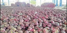  ?? HT PHOTO ?? Farmers say they are forced to sell onions for ₹7- 9 per kg.