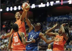  ?? SEAN D. ELLIOT — THE DAY VIA AP ?? Connecticu­t Sun forward Alyssa Thomas, top left, beats Minnesota Lynx center Sylvia Fowles (34) to a rebound as Sun guard Courtney Williams (10) and forward Chiney Ogwumike, right, watch during the first half of a WNBA basketball game, Saturday at...