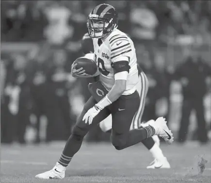  ?? ARMANDO L. SANCHEZ/CHICAGO TRIBUNE ?? Bears quarterbac­k Mitch Trubisky (10) runs the ball during the first quarter against the Cowboys at Soldier Field on Thursday in Chicago.