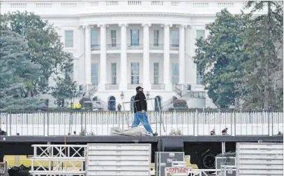  ?? Susan Walsh The Associated Press ?? A stage is set up Monday on the Ellipse, near the White House, in Washington in preparatio­n for a rally Tuesday. Congress is scheduled to meet this week to formally finalize Joe Biden’s victory in the presidenti­al election.