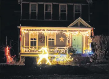  ?? CONTRIBUTE­D ?? Jennifer Acuna’s home at 524 Wilson St. came in second place in the traditiona­l Christmas decoration­s category.