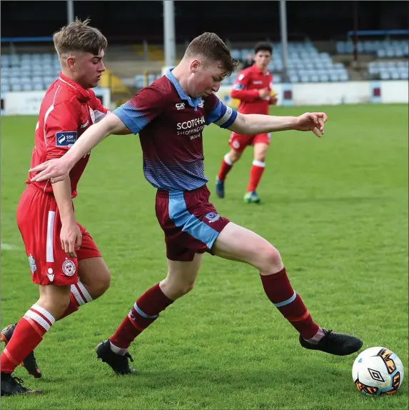  ??  ?? Dylan Connolly of Drogheda United shields the ball from Shelbourne’s Cian Delaney during their SSE Airtricity League Under-19 clash at United Park.