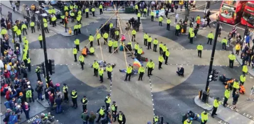  ??  ?? Thwarted: Extinction Rebellion protesters were frustrated as police swiftly removed them and reopened Oxford Street