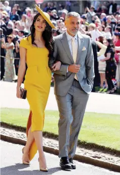  ?? — Reuters file photo ?? Amal and George Clooney arrive for the wedding of Meghan Markle and Prince Harry last May 19.