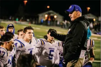  ?? NATE HECKENBERG­ER — FOR DIGITAL FIRST MEDIA ?? Downingtow­n West’s Ryan Wetzel (4) listens to coach Mike Milano following a 35-21 loss to North Penn.