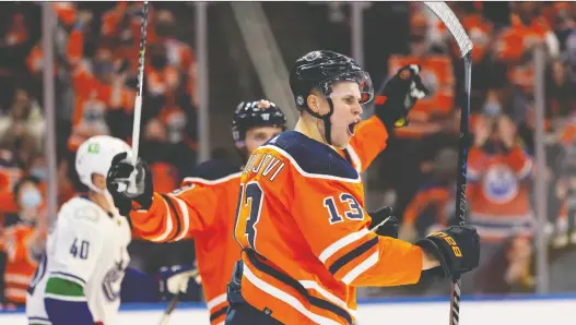  ?? IAN KUCERAK ?? The Oilers' Jesse Puljujarvi celebrates the team's first goal of the season Wednesday at Rogers Place. Darnell Nurse and Connor Mcdavid were credited with assists.