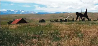  ??  ?? This file photo shows ‘Two Discs’ (right), a sculpture by Alexander Calder on loan from the Hirshhorn Museum in Washington, DC, and the Olivier Music Barn (left) seen at the Tippet rise Art Center near Fishtail, Montana.