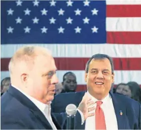  ?? ELISE AMENDOLA/ASSOCIATED PRESS ?? New Jersey Gov. Chris Christie smiles as he is introduced by Gov. Larry Hogan. In February, Hogan made clear that his support for Christie, who dropped out, “did not translate” to Donald Trump.