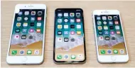 ?? — Reuters ?? SLEEK MODELS: (From left to right) iPhone 8 Plus, iPhone X and iPhone 8 models.