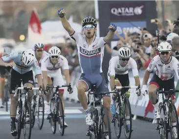  ??  ?? 0 Peter Sagan wins the UCI World Championsh­ip race in Doha yesterday, pipping Britain’s Mark Cavendish, far right, who was bidding to win his second Road World Championsh­ip.