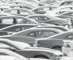  ?? TORSTAR MARCUS OLENIUK ?? New cars just off the assembly line at a General Motors plant in Oshawa,Ont. Statistica­lly, the provincial economy is the strongest in decades.