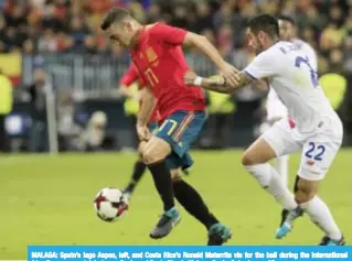  ??  ?? MALAGA: Spain’s Iago Aspas, left, and Costa Rica’s Ronald Matarrita vie for the ball during the internatio­nal friendly soccer match between Spain and Costa Rica in Malaga, Spain, Saturday. — AP