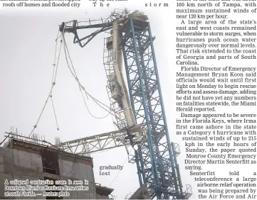  ??  ?? A collapsed constructi­on crane is seen in Downtown Miami as Hurricane Irma arrives at south Florida. — Reuters photo gradually lost