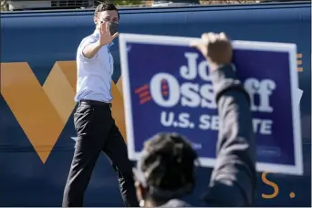  ?? BEN GRAY — THE ASSOCIATED PRESS FILE ?? In this Dec. 21, 2020, file photo Democratic U.S. Senate challenger Jon Ossoff during a rally in Columbus, Ga. with Vice President-elect Kamala Harris and fellow Democratic U.S. Senate challenger the Rev. Raphael Warnock.