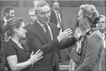  ?? AP PHOTO ?? NATO Secretary General Jens Stoltenber­g, centre, speaks with Canadian Foreign Minister Chrystia Freeland, left, and Croatian Foreign Minister Majija Pejcinovic Buric, right, during a meeting of the North Atlantic Council and the Balkans at NATO headquarte­rs in Brussels, Wednesday.