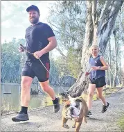  ??  ?? ■ Craig Woolston, daughter Madeline and dog Wally at parkrun.