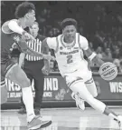  ?? ROBERT DEUTSCH/USA TODAY SPORTS ?? Wisconsin guard AJ Storr drives against James Madison guard Terrence Edwards Jr. in the first round of the NCAA Tournament at Barclays Center.